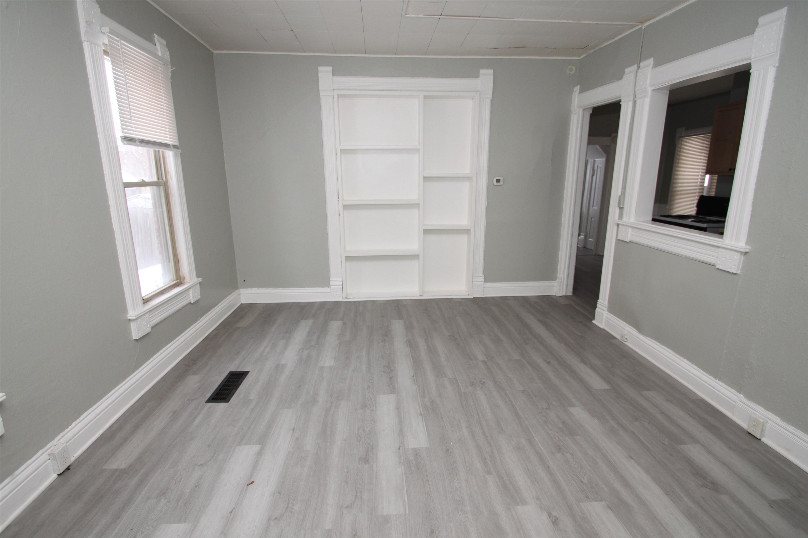 328 South Prospect Street Rockford, IL 61104 - Photo 7 of 14 wooden floor in an empty room with a window