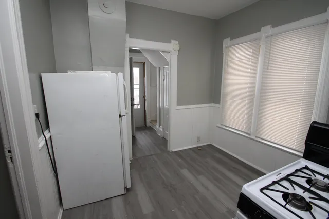 a kitchen with a stove and a refrigerator