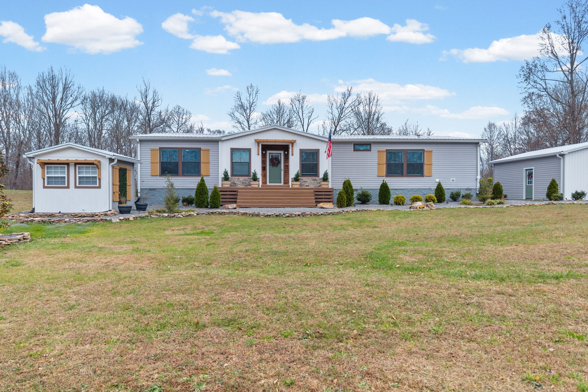 a front view of house with yard and green space