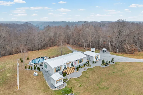 a view of a terrace with a table and chairs