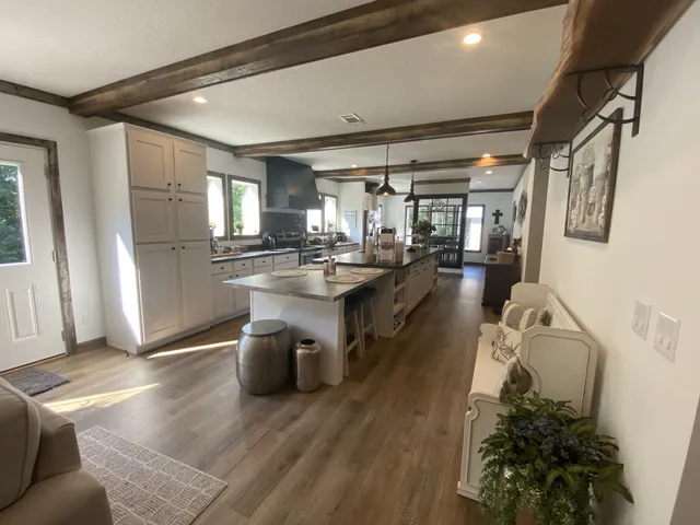 a kitchen with sink refrigerator and window