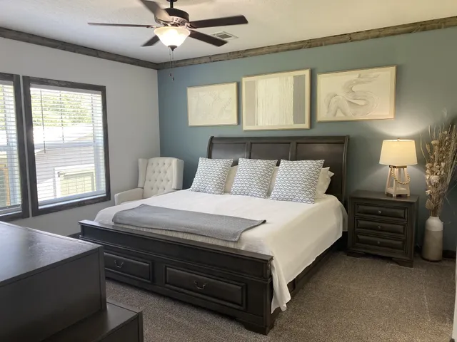 a bedroom with a bed and window