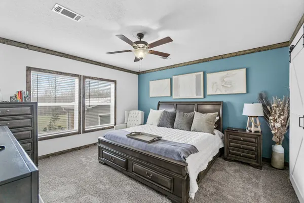 a bed room with furniture and a window