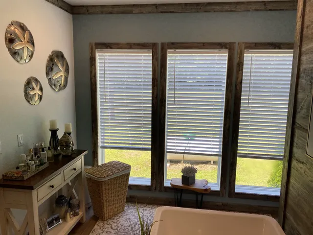 a bathroom with a sink and a large mirror