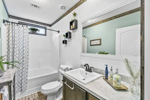 a view of a storage & utility room with dryer and washer