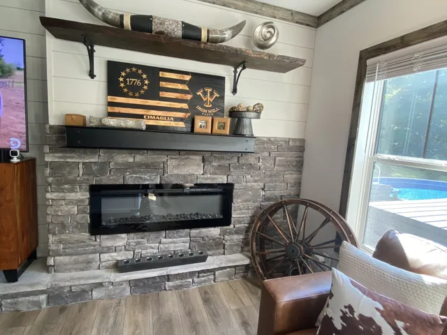 a living room with furniture and a fireplace
