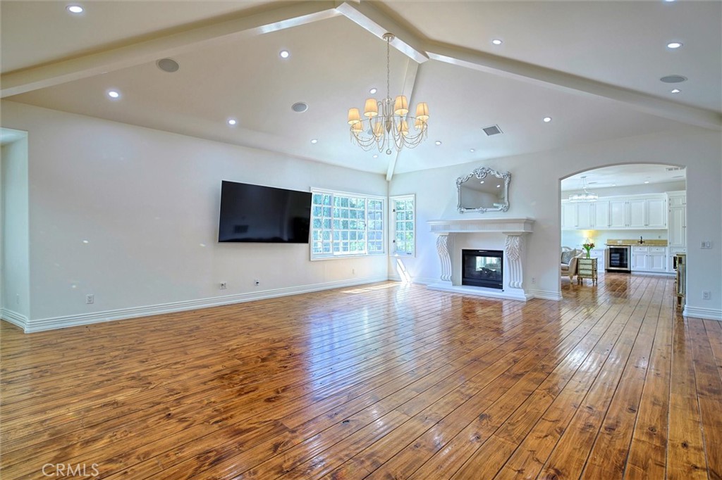 5839 Jed Smith Road Hidden Hills, CA 91302 - Photo 15 of 46 a view of a livingroom with furniture wooden floor and chandelier