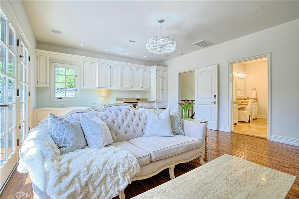 5839 Jed Smith Road Hidden Hills, CA 91302 - Photo 16 of 46 a living room with furniture and wooden floor