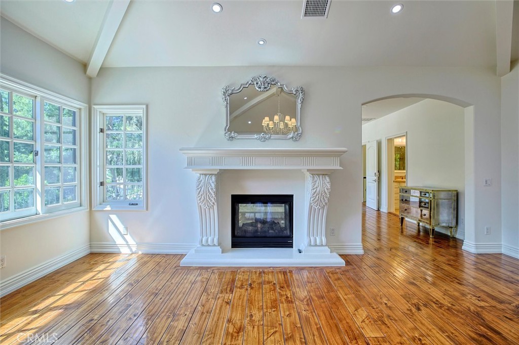 5839 Jed Smith Road Hidden Hills, CA 91302 - Photo 18 of 46 a living room with furniture and a fireplace