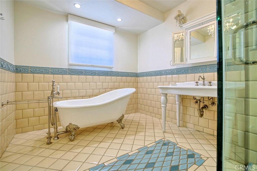 5839 Jed Smith Road Hidden Hills, CA 91302 - Photo 27 of 46 a bathroom with a sink a toilet and shower