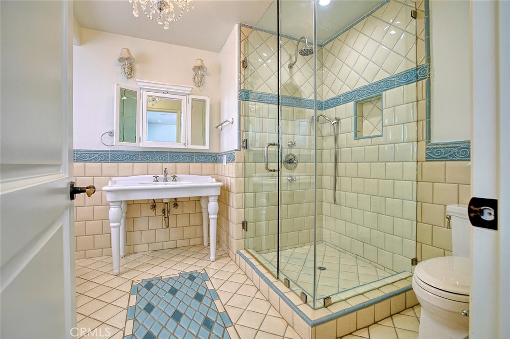 5839 Jed Smith Road Hidden Hills, CA 91302 - Photo 28 of 46 a bathroom with a shower toilet and sink