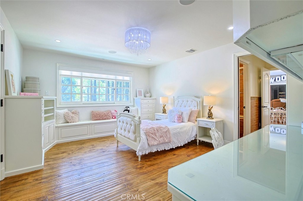 5839 Jed Smith Road Hidden Hills, CA 91302 - Photo 29 of 46 a bed room with two beds and a large window