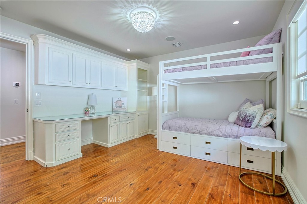 5839 Jed Smith Road Hidden Hills, CA 91302 - Photo 30 of 46 a bedroom with a bed and a dresser