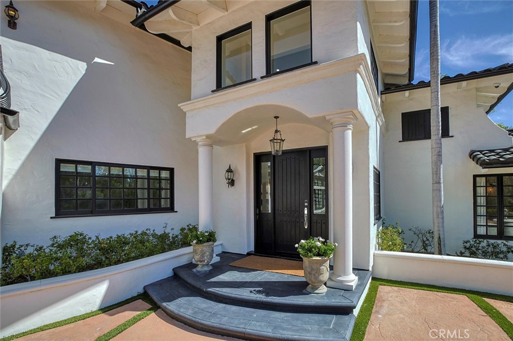 5839 Jed Smith Road Hidden Hills, CA 91302 - Photo 3 of 46 a front view of a house with garden