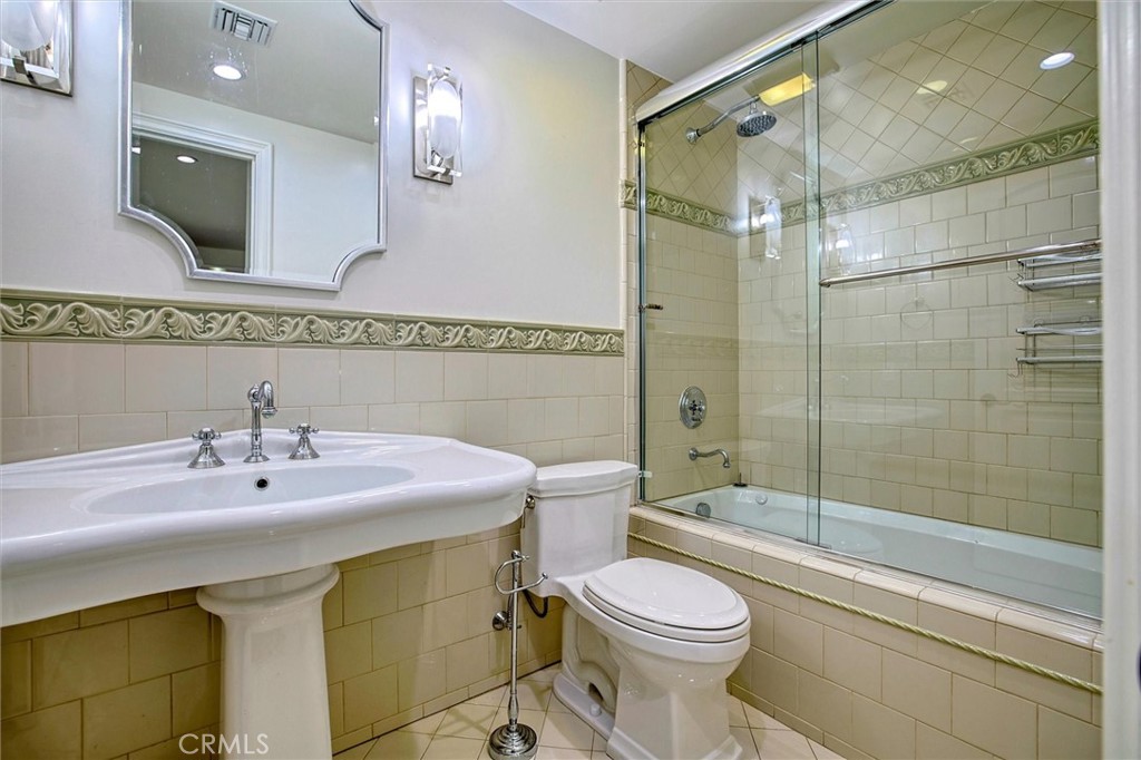 5839 Jed Smith Road Hidden Hills, CA 91302 - Photo 31 of 46 a bathroom with a sink a toilet and shower