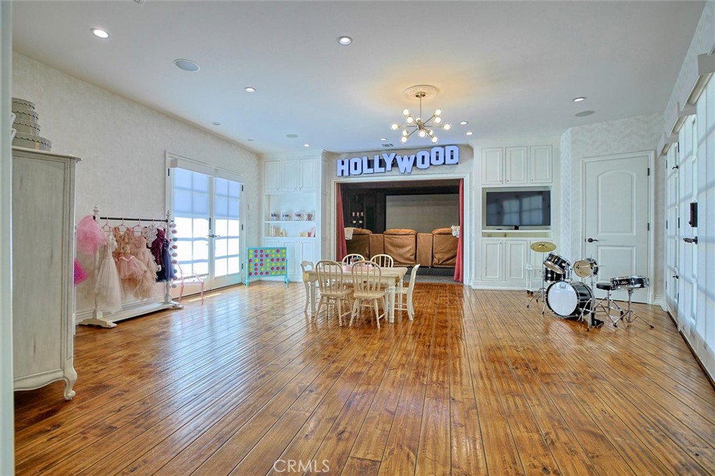 5839 Jed Smith Road Hidden Hills, CA 91302 - Photo 32 of 46 a living room with furniture and a wooden floor