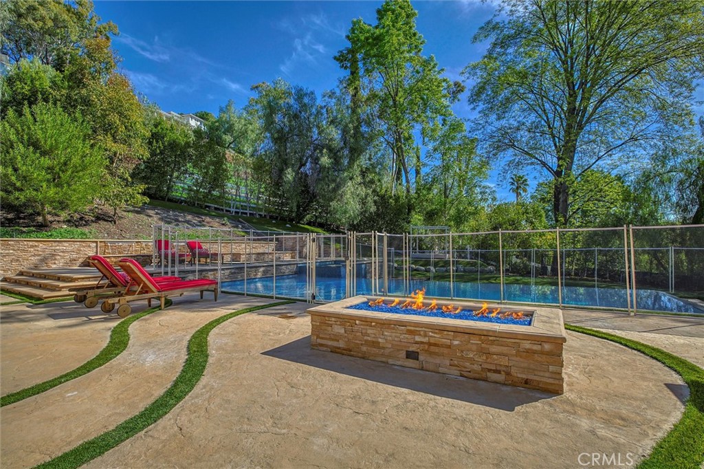 5839 Jed Smith Road Hidden Hills, CA 91302 - Photo 37 of 46 a view of a swimming pool with a slide