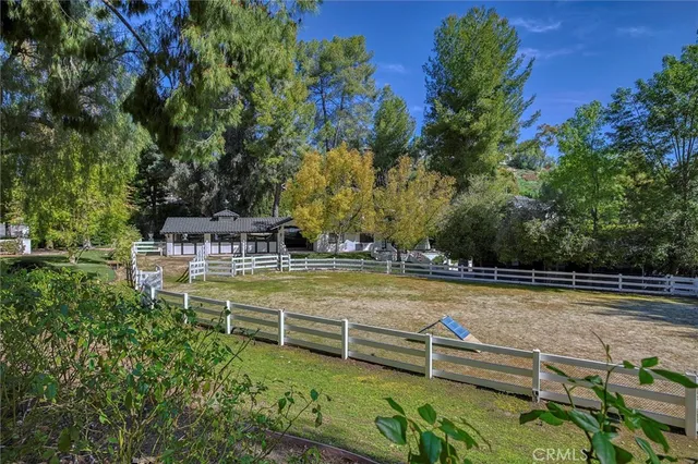 a view of a room with window and furniture
