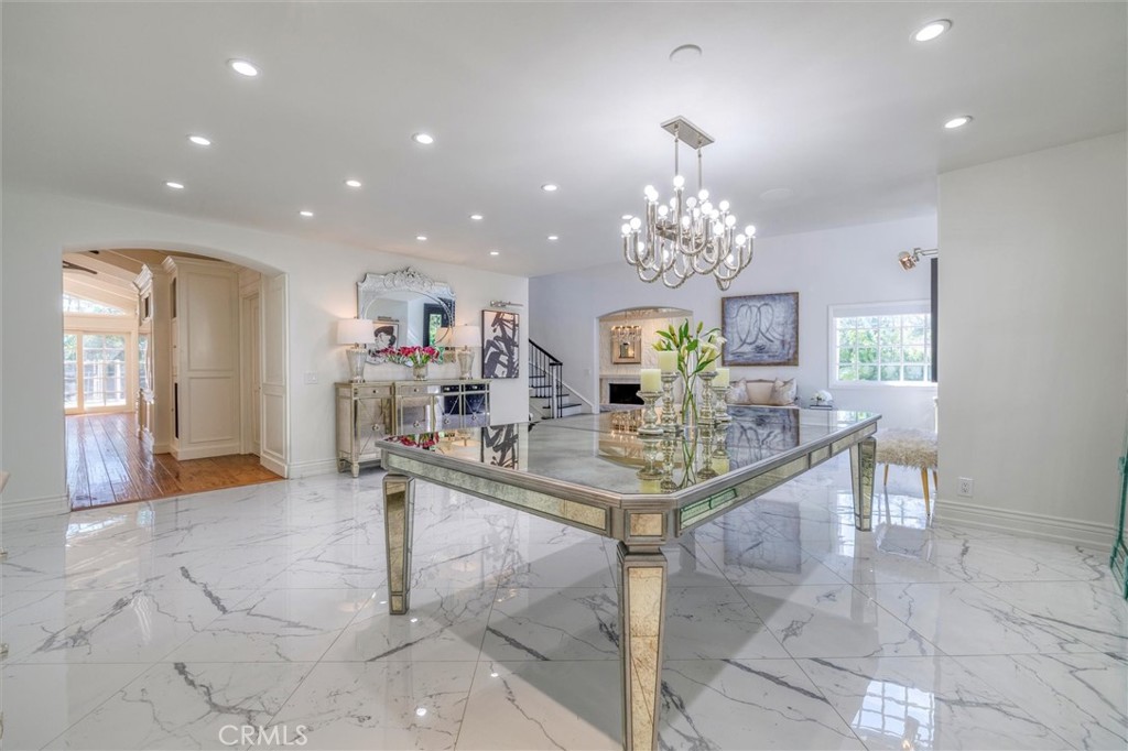 5839 Jed Smith Road Hidden Hills, CA 91302 - Photo 6 of 46 a view of a dining room with furniture and a chandelier