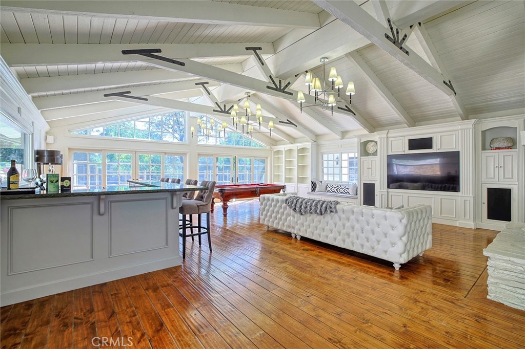 5839 Jed Smith Road Hidden Hills, CA 91302 - Photo 8 of 46 a living room with furniture and a flat screen tv
