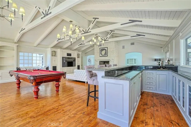 a bedroom with furniture and a large window