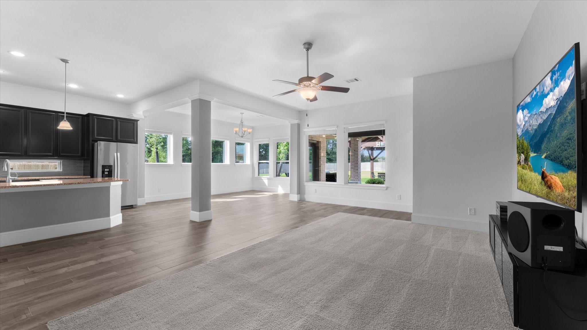 32001 Birch Briar Court Spring, TX 77386 - Photo 16 of 48 Spacious family room designed for comfortable everyday living with abundant natural light and an effortless connection to the kitchen.