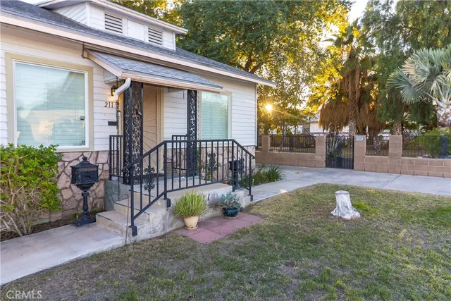 a kitchen with wooden cabinets and a stove top oven