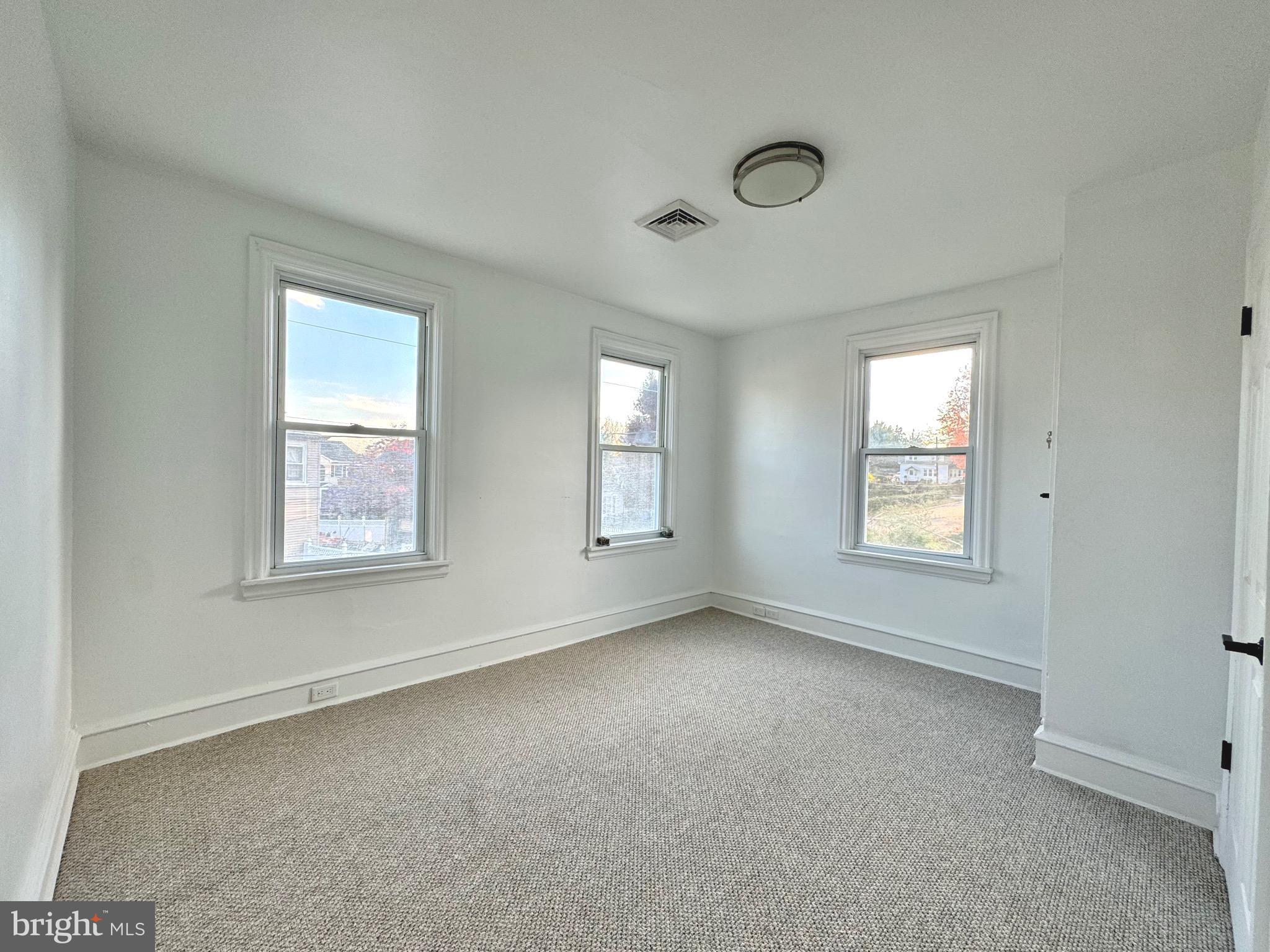 1121 Rosedale Avenue Wilmington, DE 19809 - Photo 13 of 37 a view of an empty room with a window