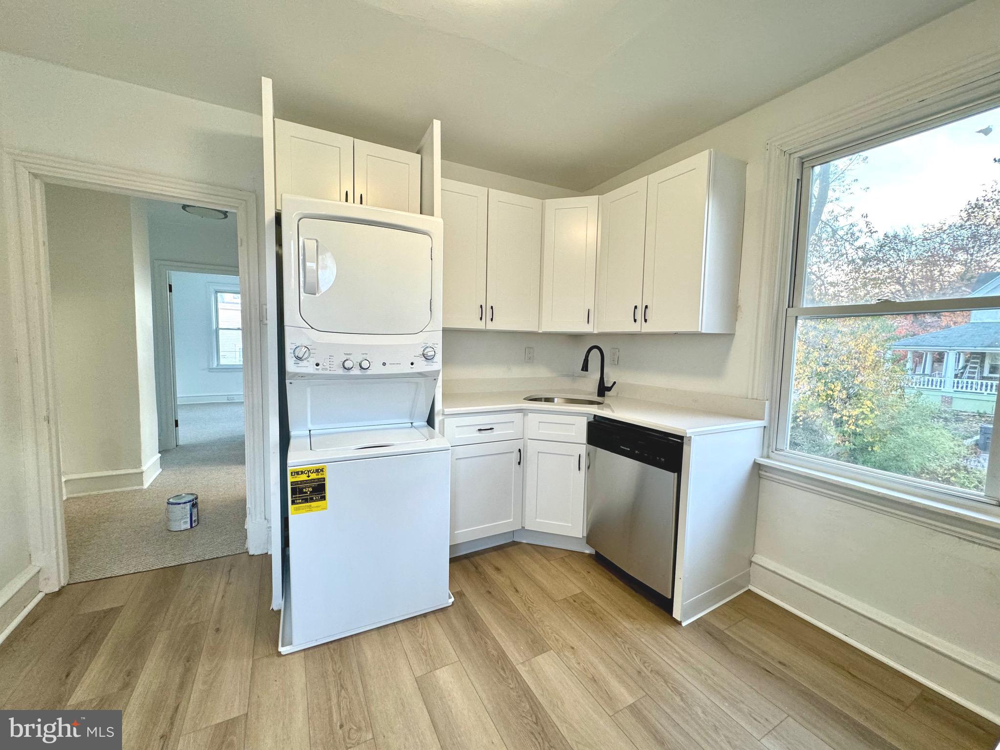 1121 Rosedale Avenue Wilmington, DE 19809 - Photo 18 of 37 a kitchen with a white cabinets and wooden floor