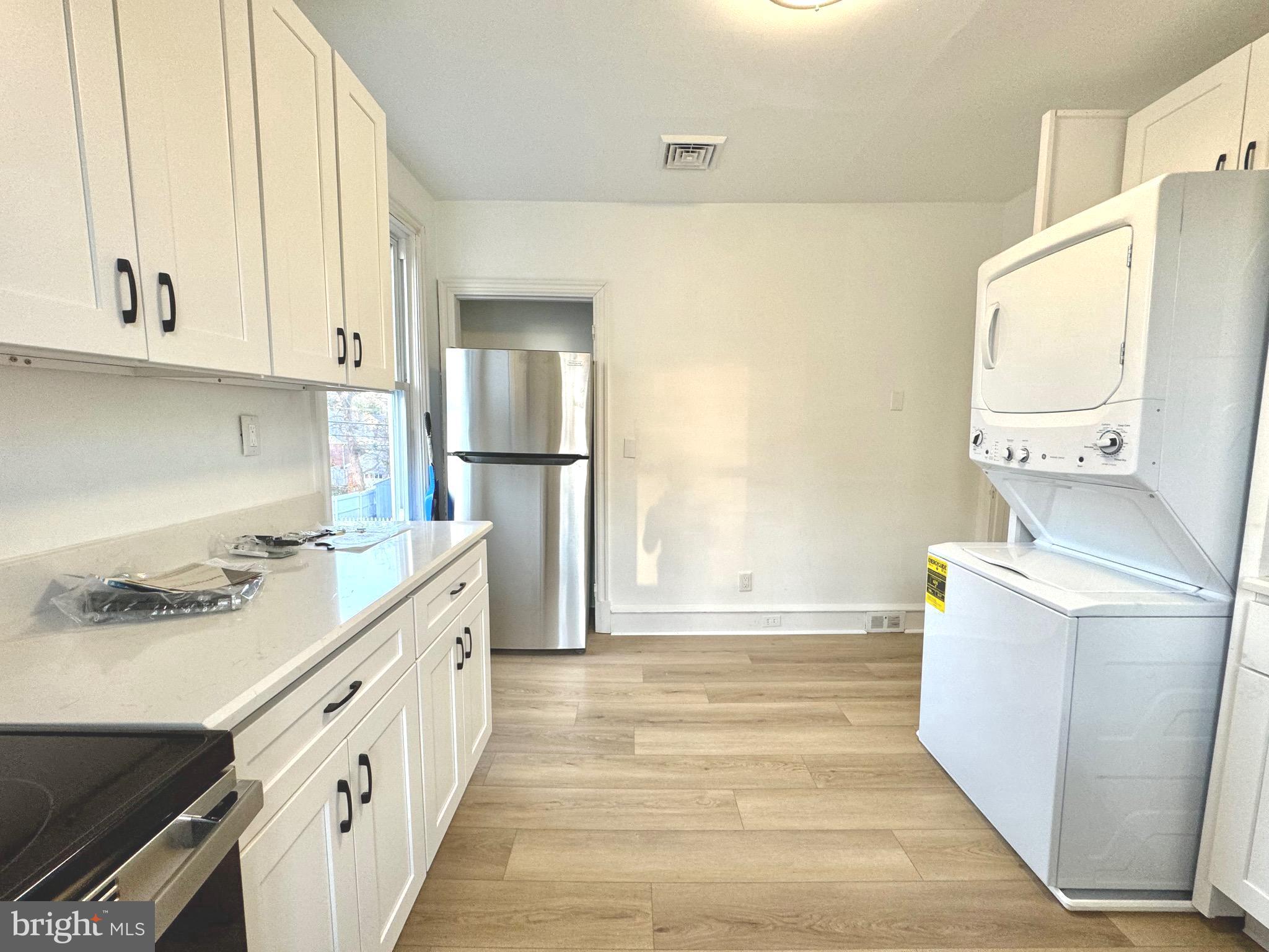 1121 Rosedale Avenue Wilmington, DE 19809 - Photo 20 of 37 a kitchen with a sink stove and refrigerator