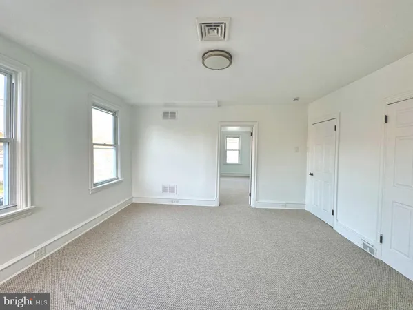an empty room with windows
