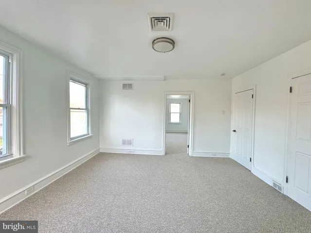 an empty room with windows