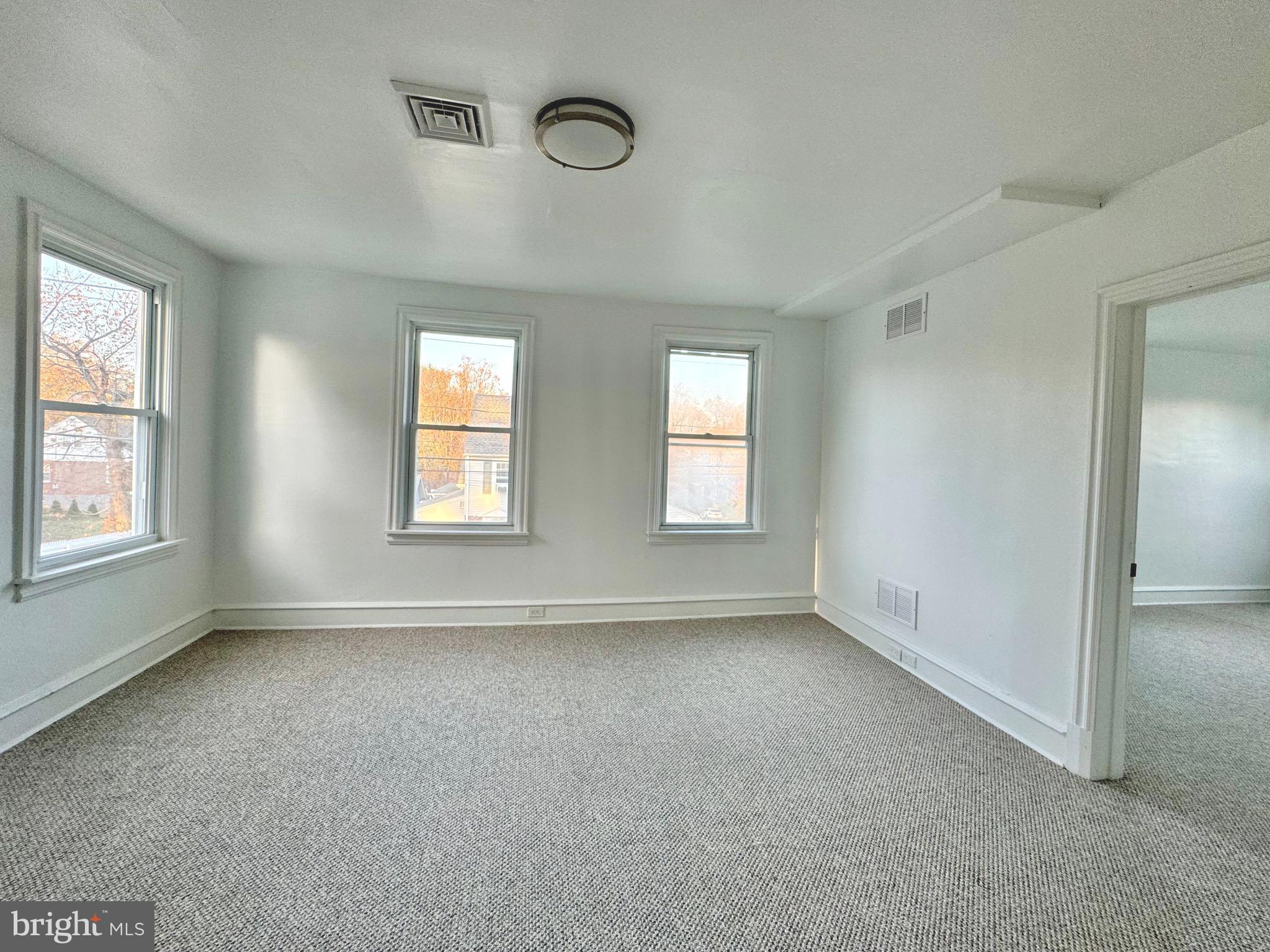 1121 Rosedale Avenue Wilmington, DE 19809 - Photo 26 of 37 an empty room with windows