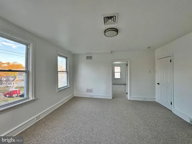 a view of a hallway with a couch