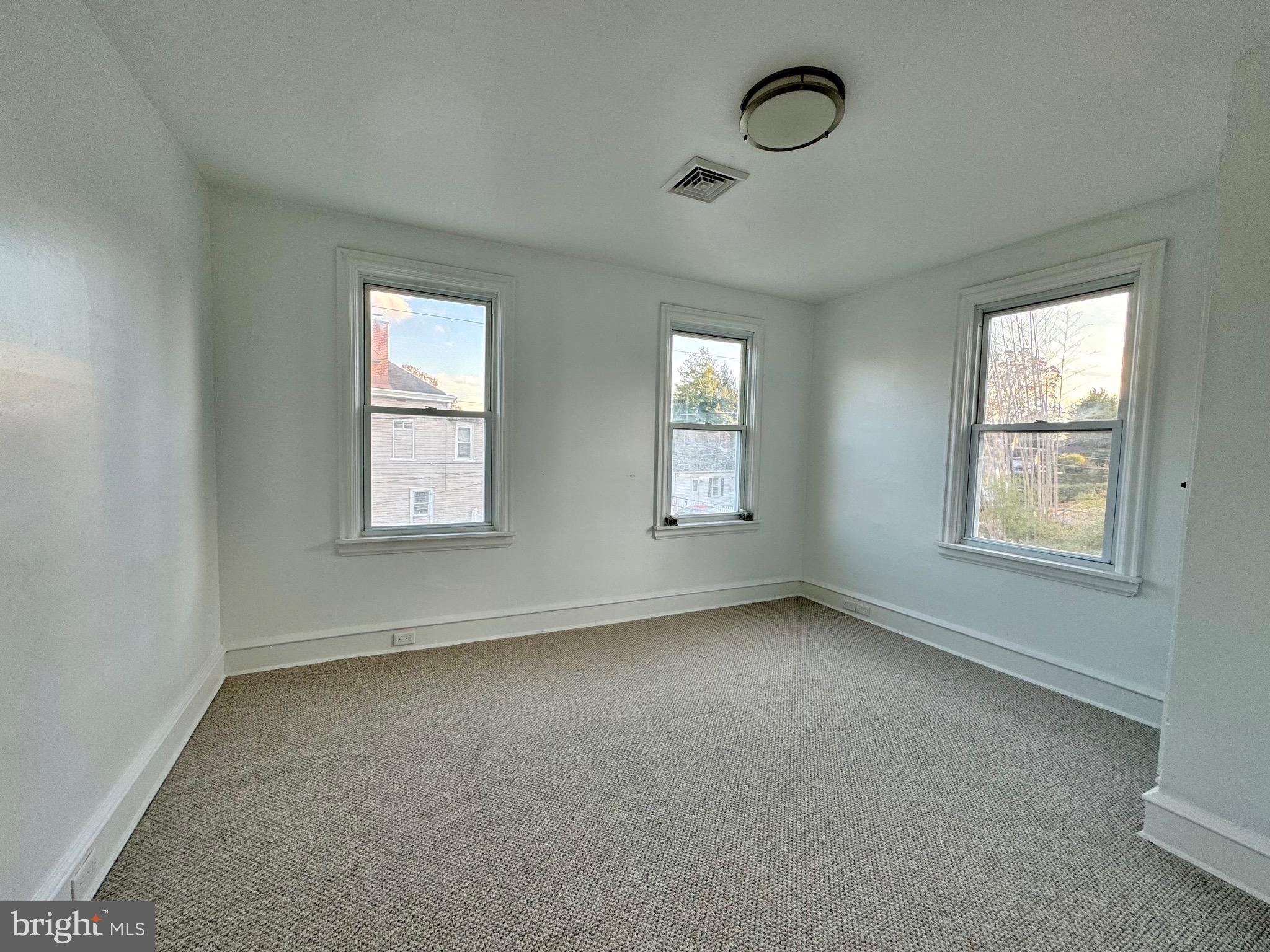 1121 Rosedale Avenue Wilmington, DE 19809 - Photo 28 of 37 an empty room with windows