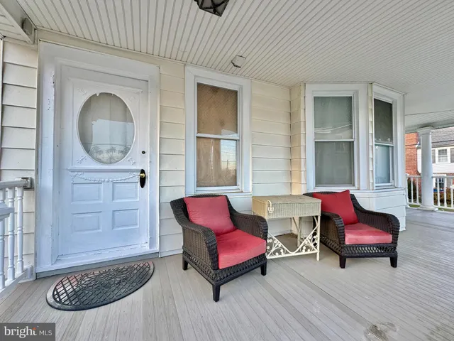 a living room with furniture a window and a fireplace