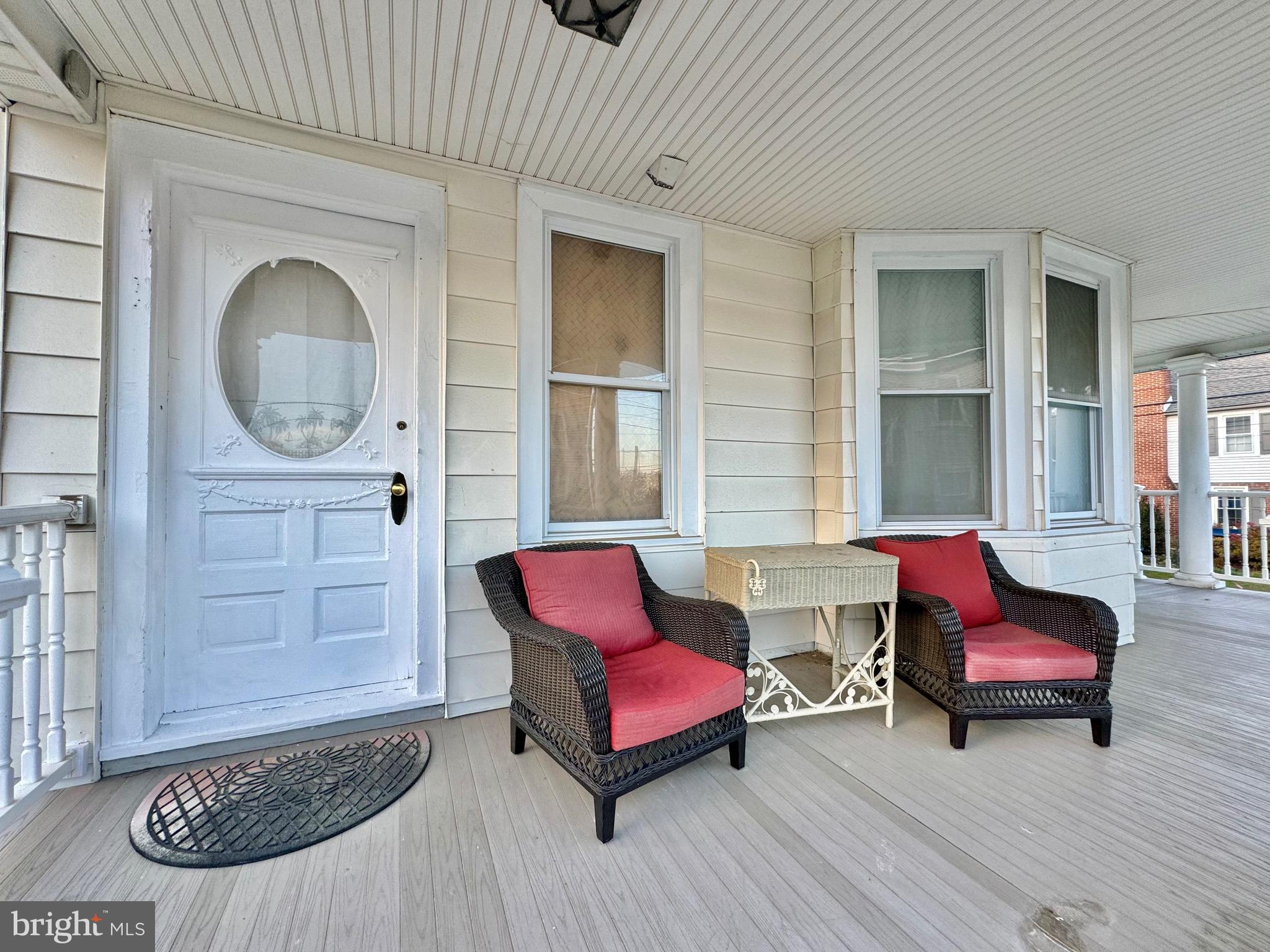 1121 Rosedale Avenue Wilmington, DE 19809 - Photo 5 of 37 a living room with furniture a window and a fireplace