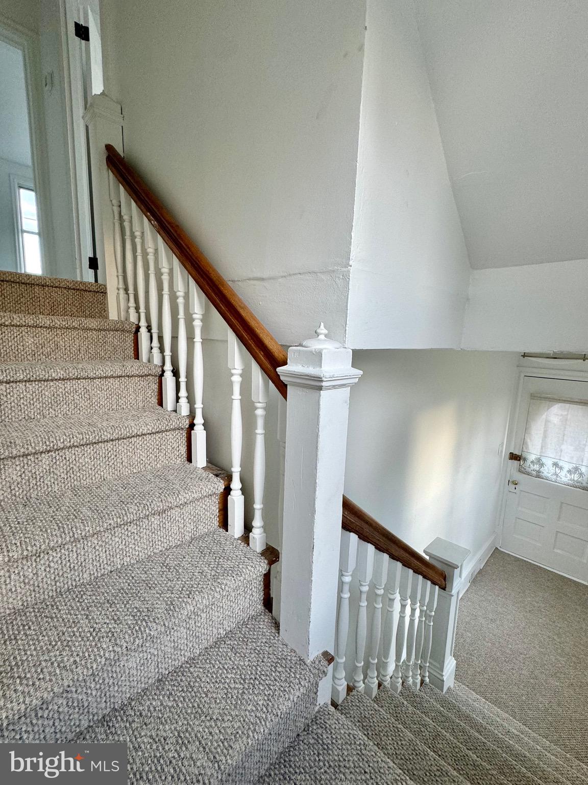 1121 Rosedale Avenue Wilmington, DE 19809 - Photo 8 of 37 a view of staircase with lots of frames on wall and stairs
