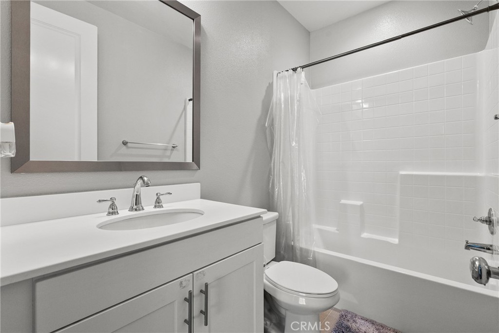 232 River Street Fillmore, CA 93015 - Photo 34 of 61 a bathroom with a sink a toilet and a mirror