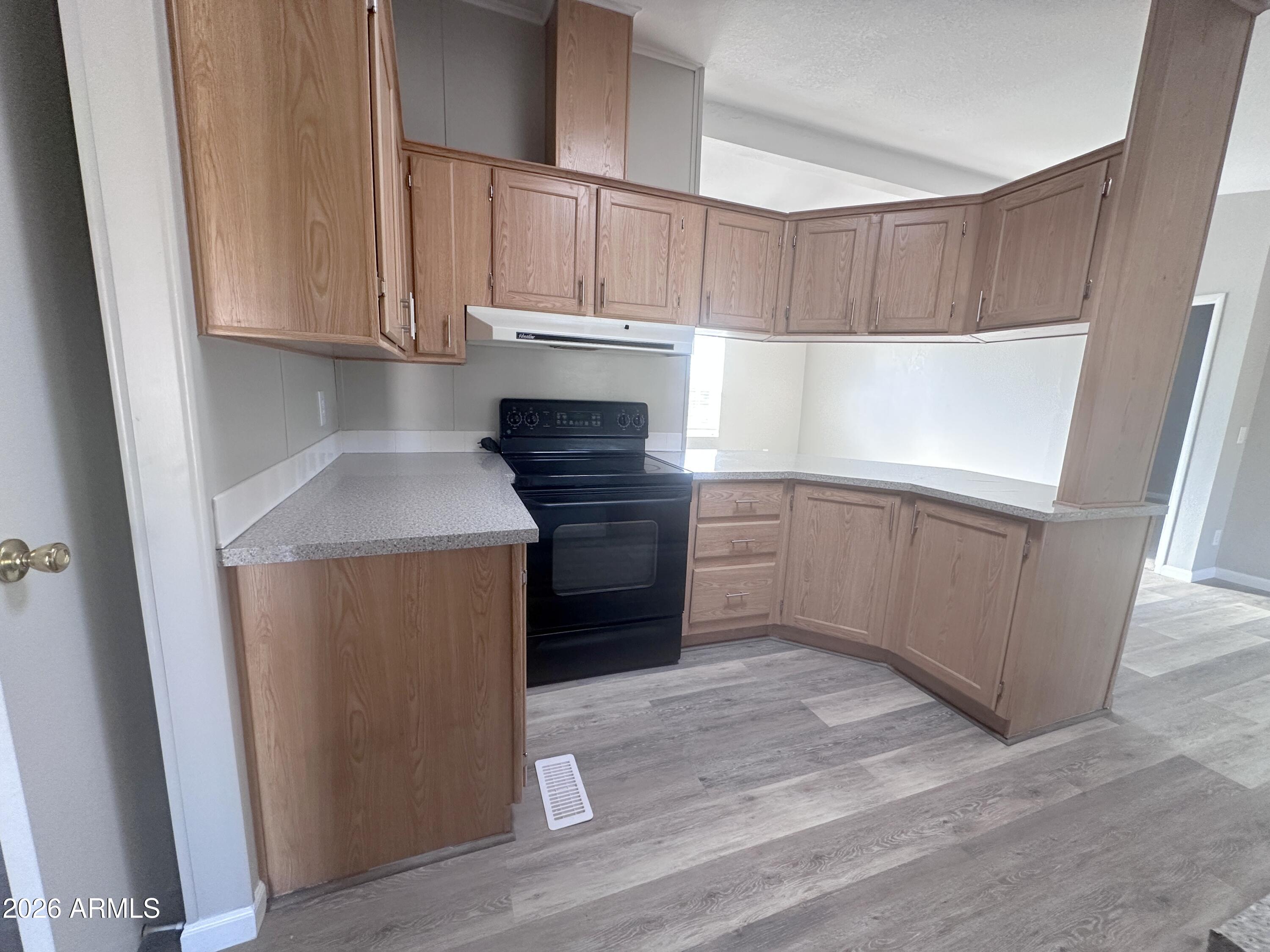 7736 West Alsdorf Road Arizona City, AZ 85193 - Photo 14 of 45 a kitchen with granite countertop white cabinets and white appliances