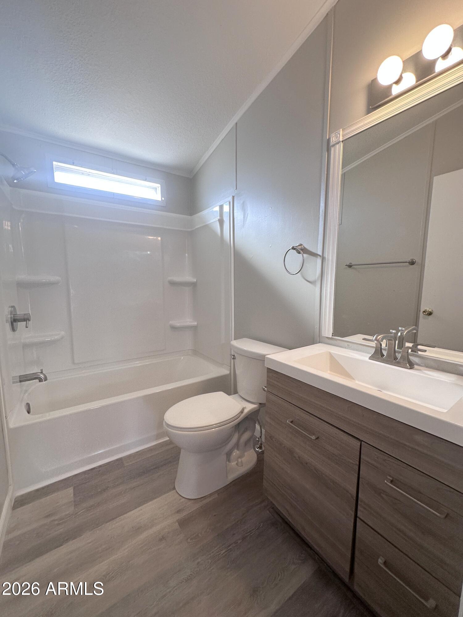 7736 West Alsdorf Road Arizona City, AZ 85193 - Photo 18 of 45 a bathroom with a double vanity sink toilet and shower