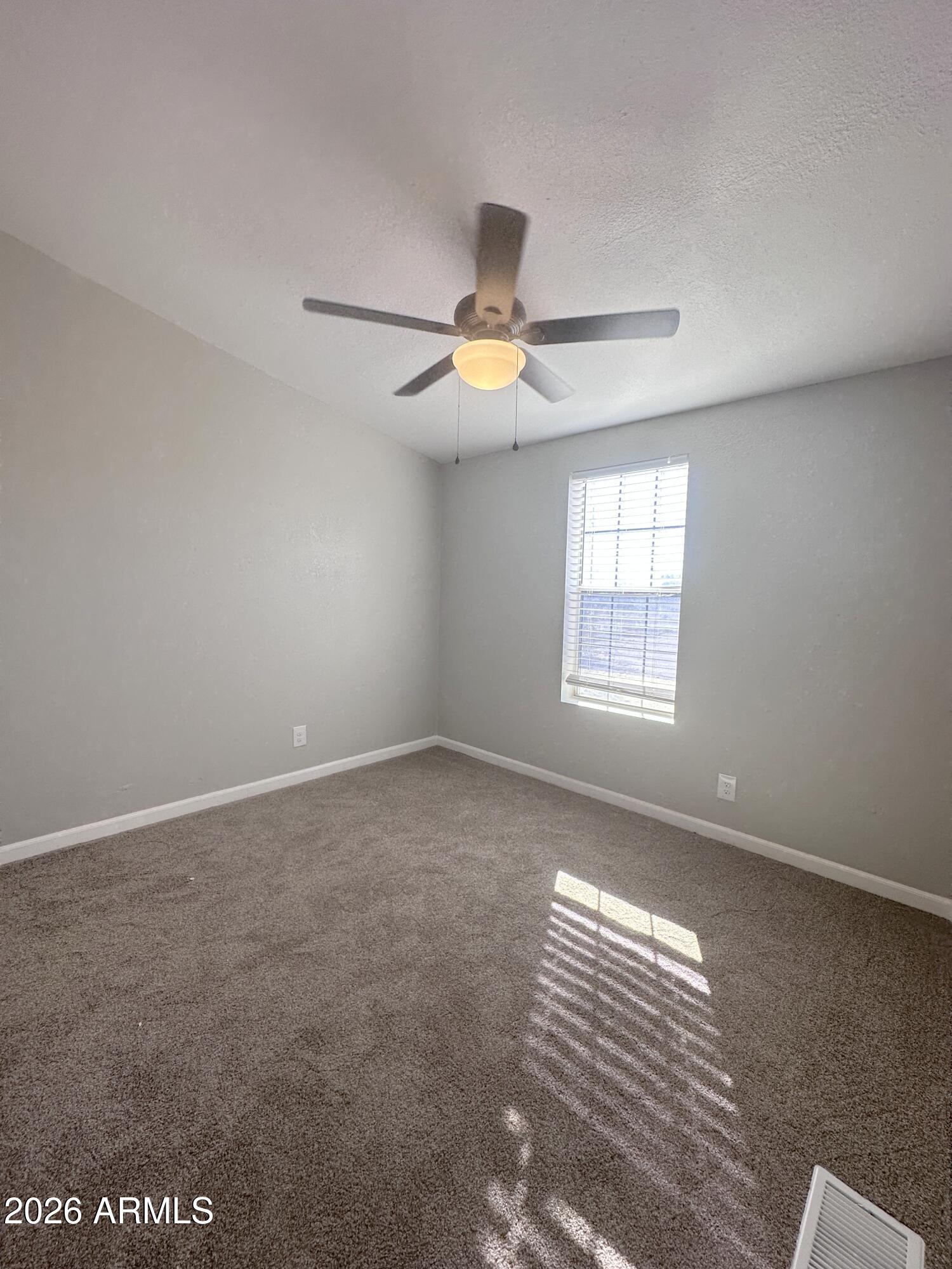 7736 West Alsdorf Road Arizona City, AZ 85193 - Photo 20 of 45 a view of an empty room with a window