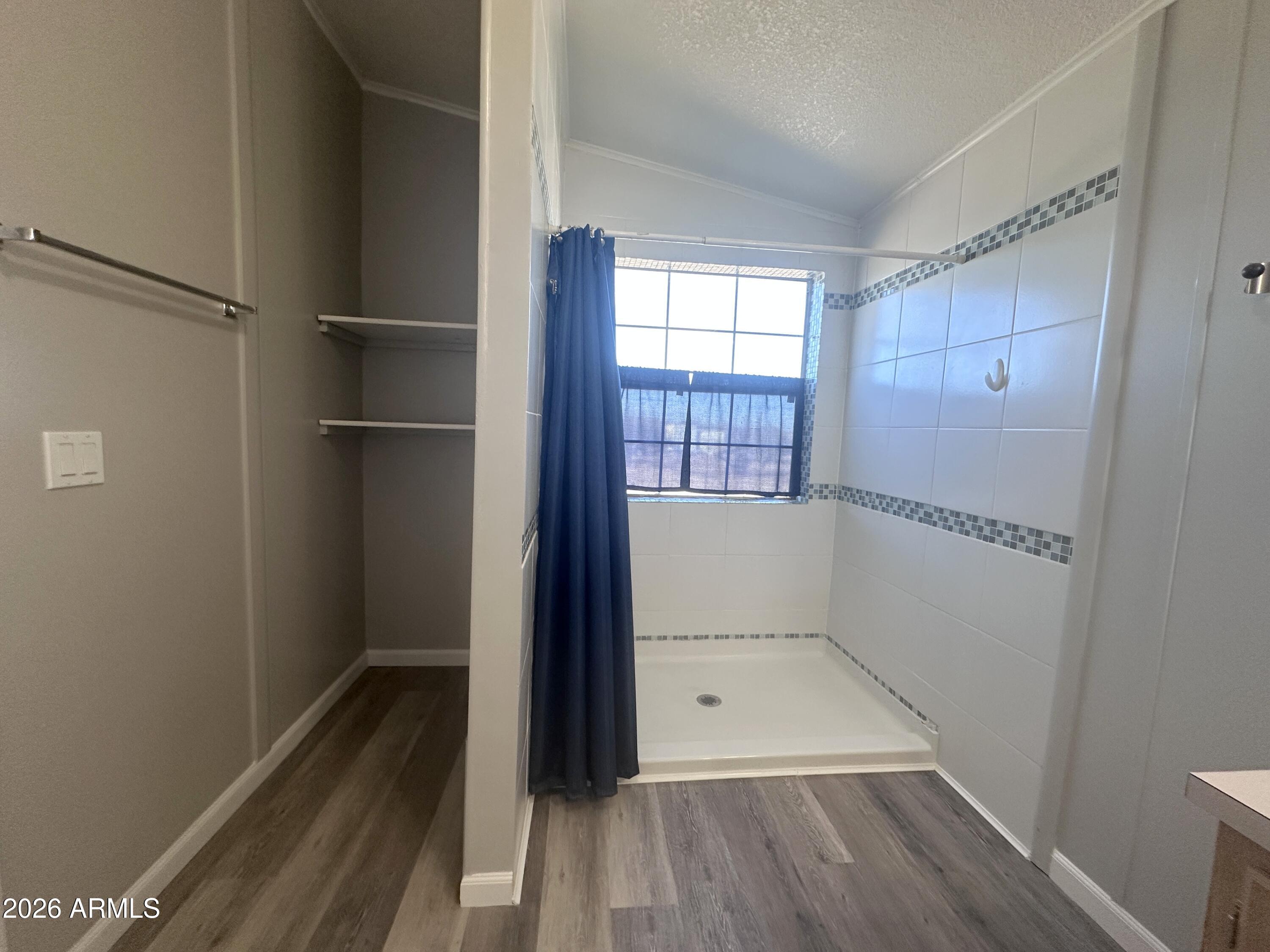7736 West Alsdorf Road Arizona City, AZ 85193 - Photo 26 of 45 wooden floor in an empty room with a window