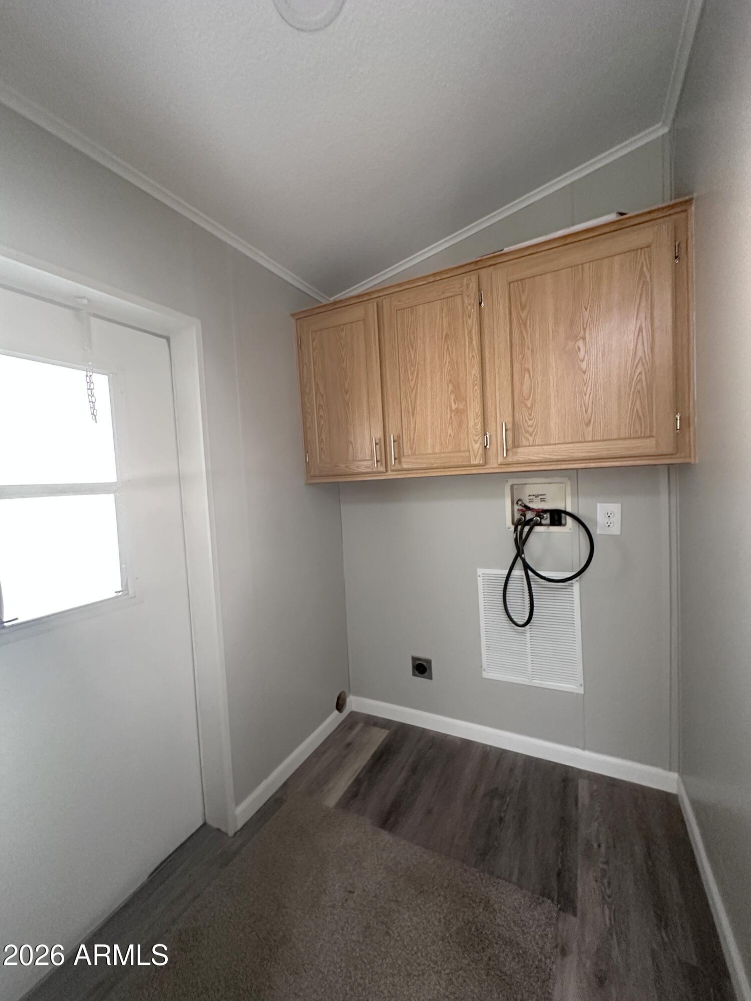 7736 West Alsdorf Road Arizona City, AZ 85193 - Photo 29 of 45 a view of a utility room with racks on the wall