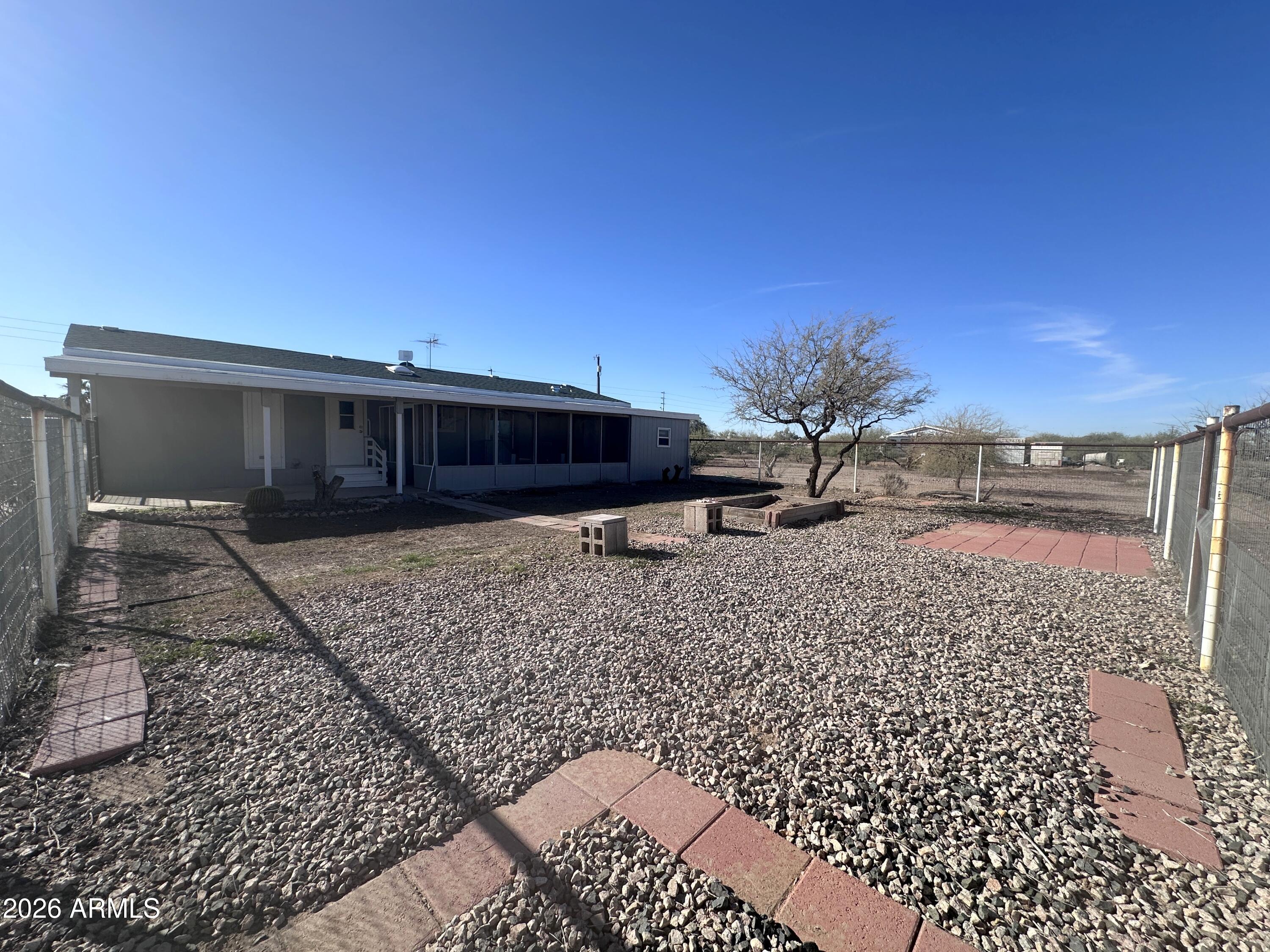 7736 West Alsdorf Road Arizona City, AZ 85193 - Photo 39 of 45 a view of a house with a yard