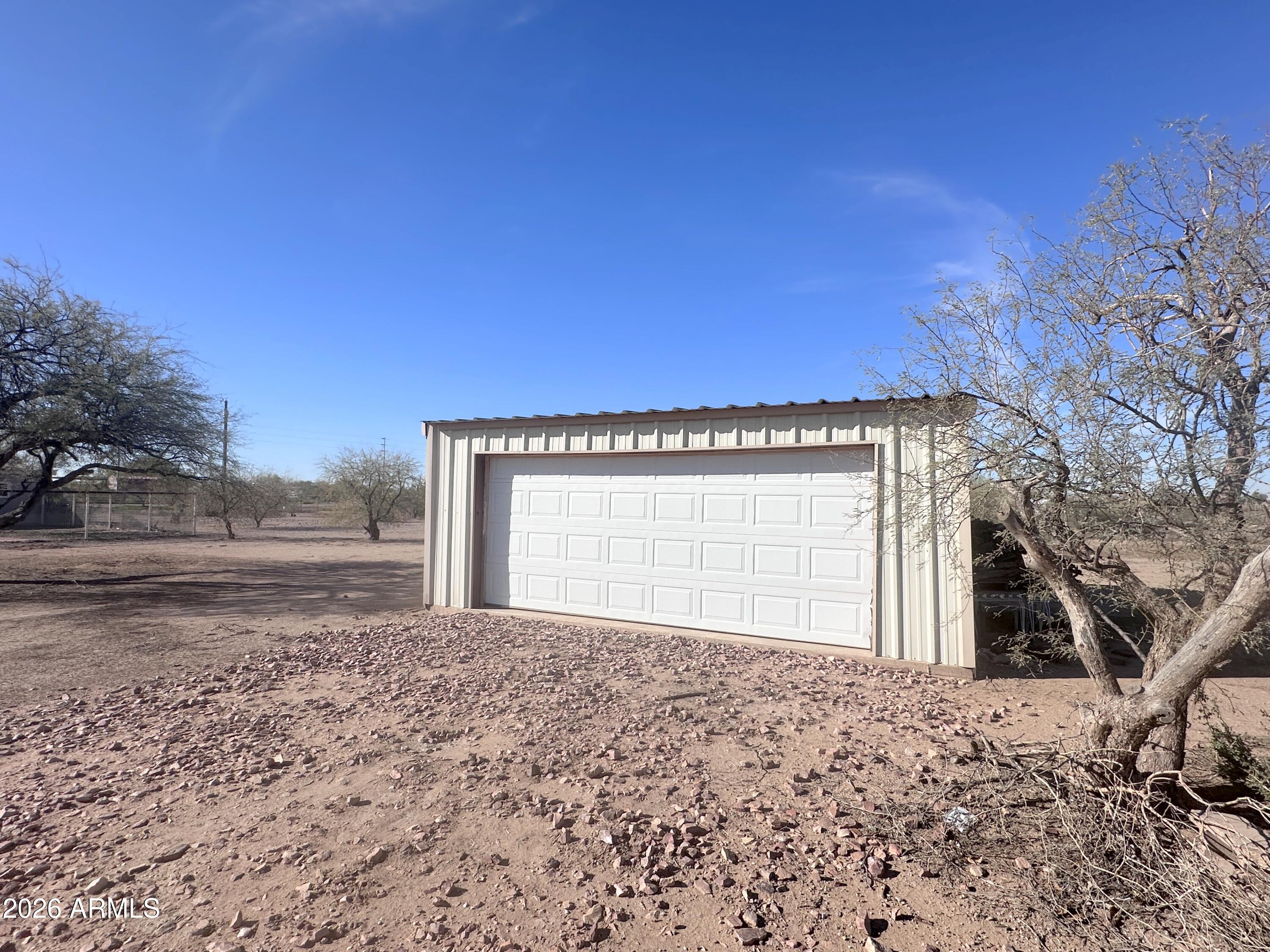 7736 West Alsdorf Road Arizona City, AZ 85193 - Photo 42 of 45 a front view of a house with a yard