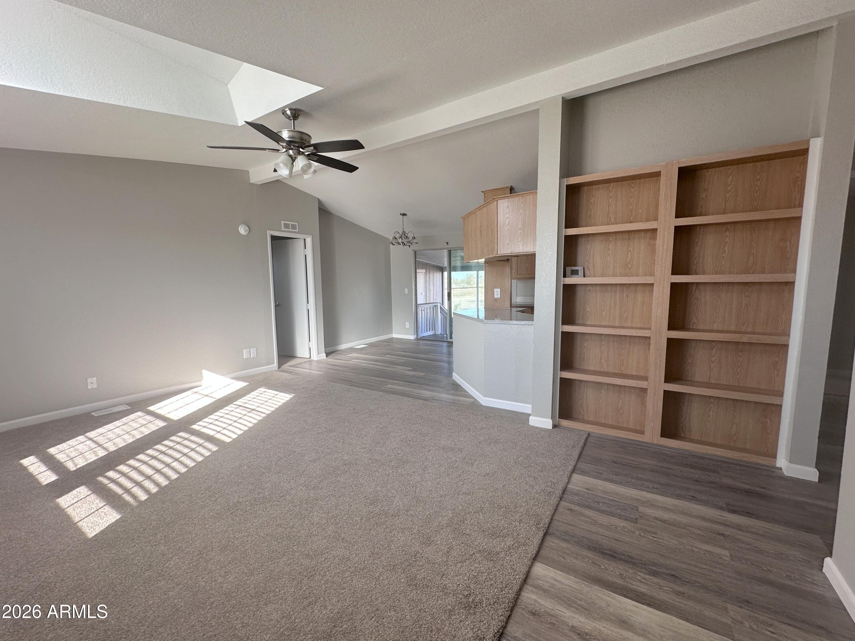 7736 West Alsdorf Road Arizona City, AZ 85193 - Photo 10 of 45 a view of empty room with wooden floor and fan