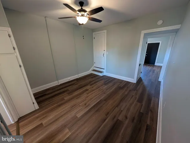 a view of room with wooden floor