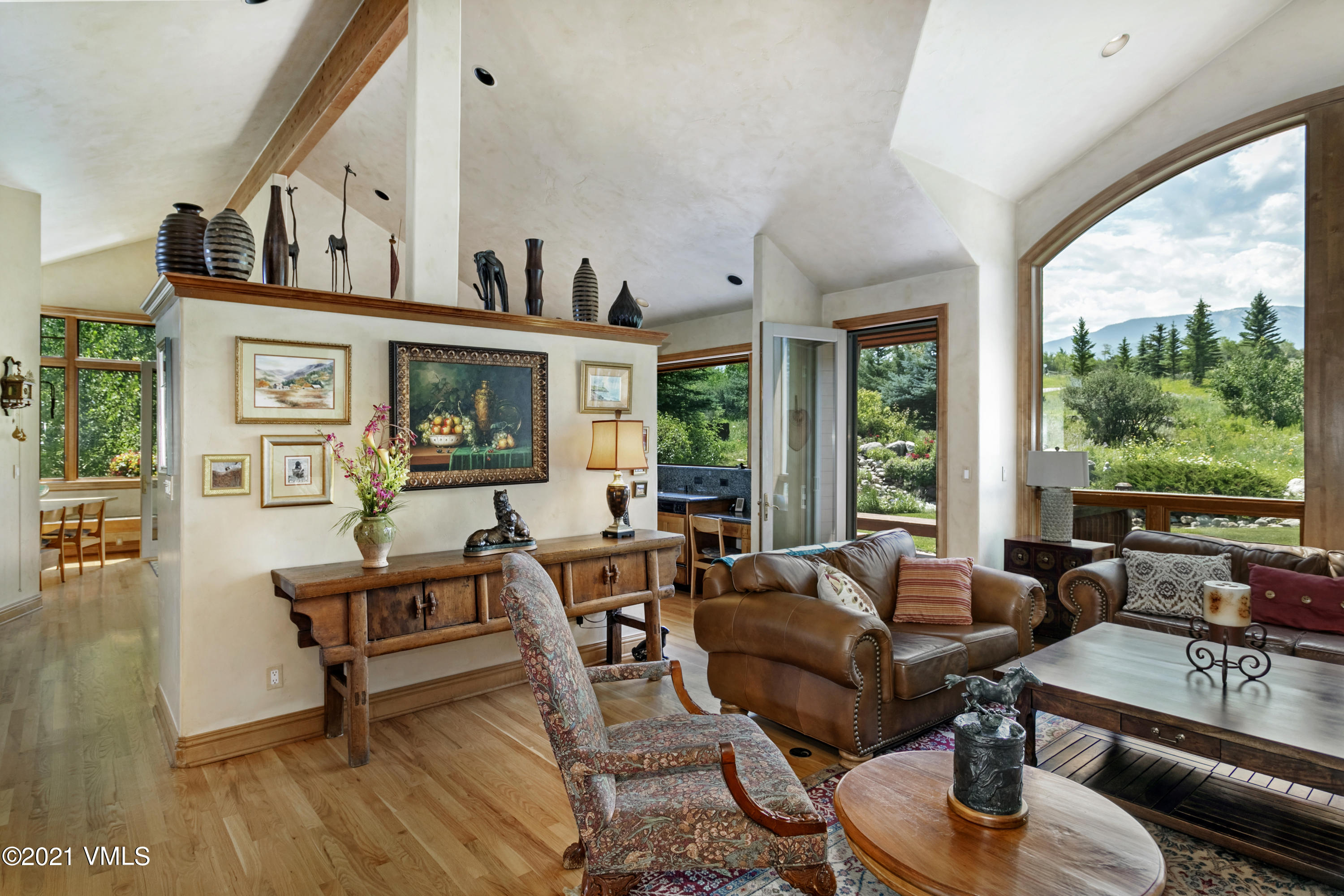 755 Eagle Crest Road Edwards, CO 81632 - Photo 11 of 56 a living room with furniture and a large window