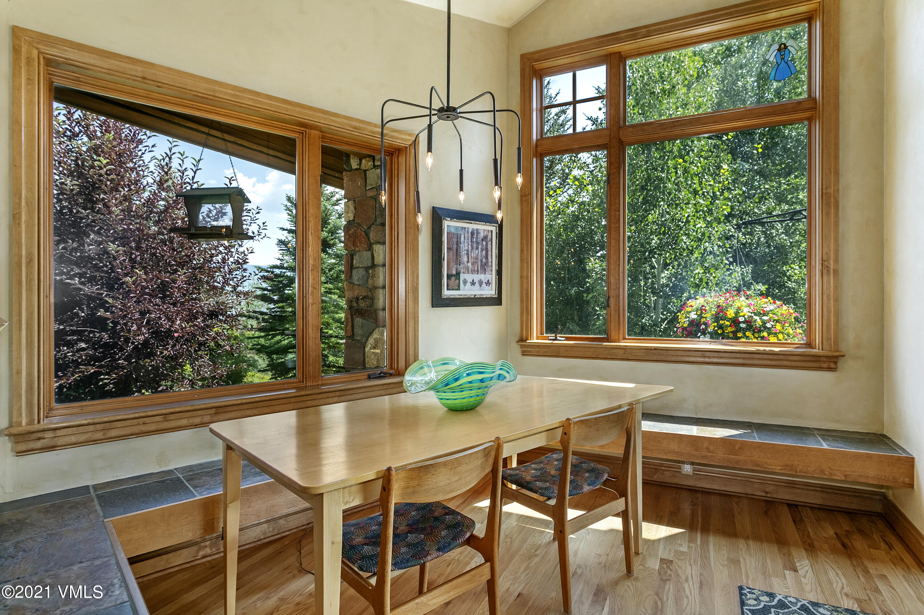 755 Eagle Crest Road Edwards, CO 81632 - Photo 14 of 56 a view of a dining room with furniture window and wooden floor